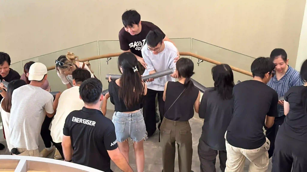 Group focused on problem-solving during a structured team-building activity.
