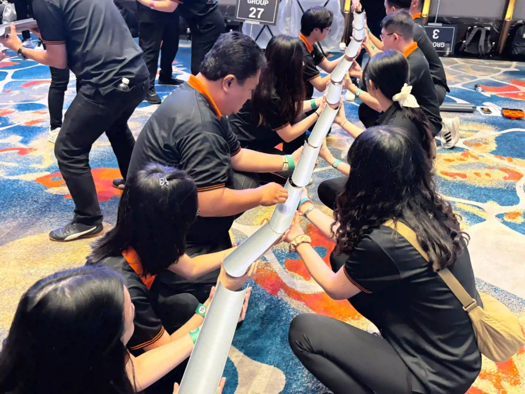 indooor team building game,members actively participating in a focused collaboration exercise