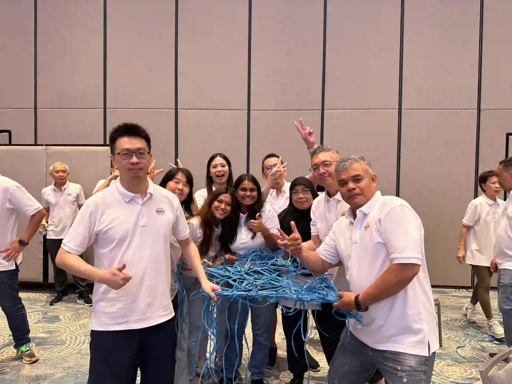A team group photo after indoor team building game