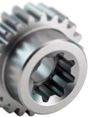 Nahaufnahme eines glänzenden Metallzahnrads mit inneren und äußeren Zähnen.