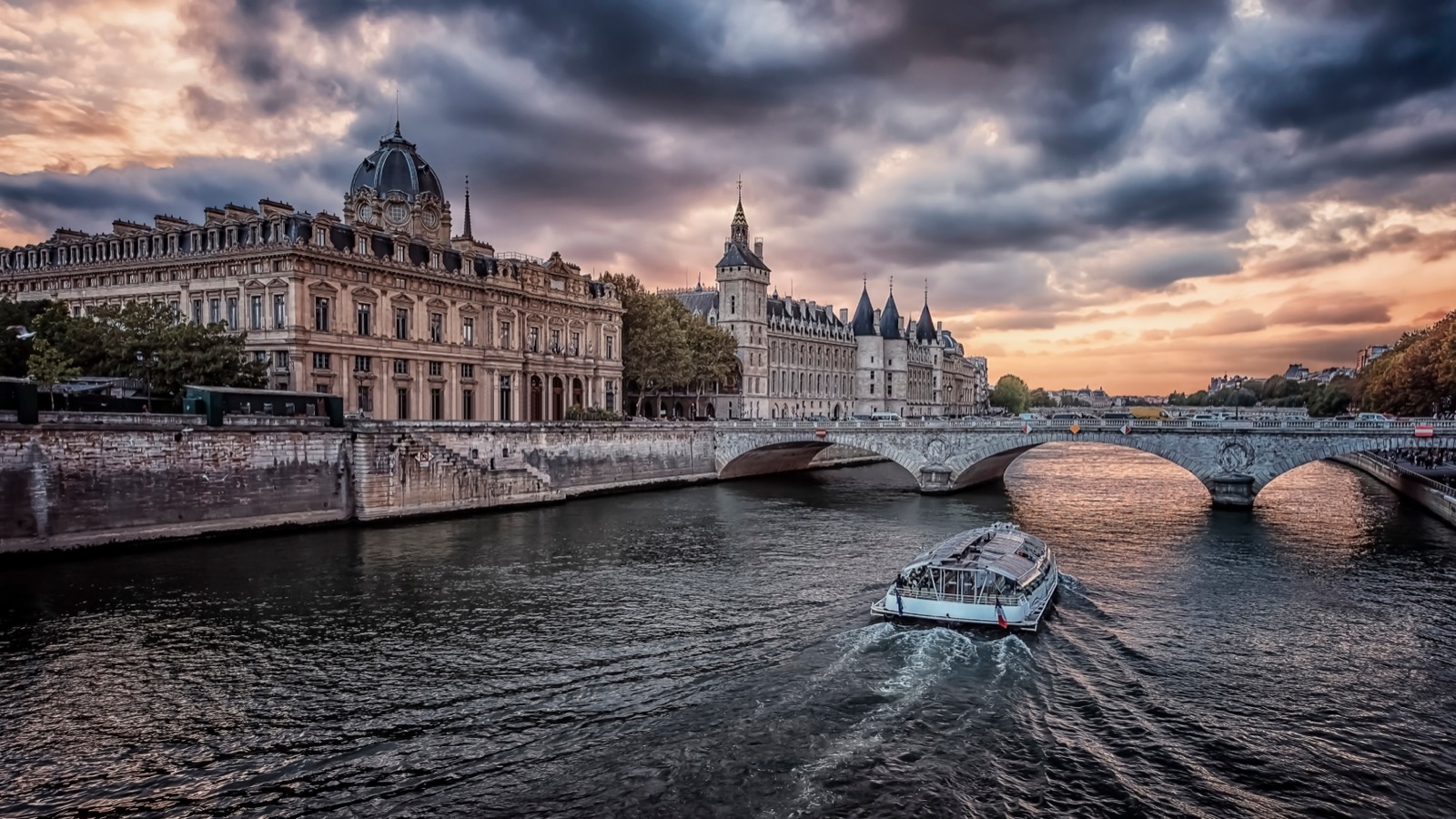 The Seine and the Conciergerie under an evening sky