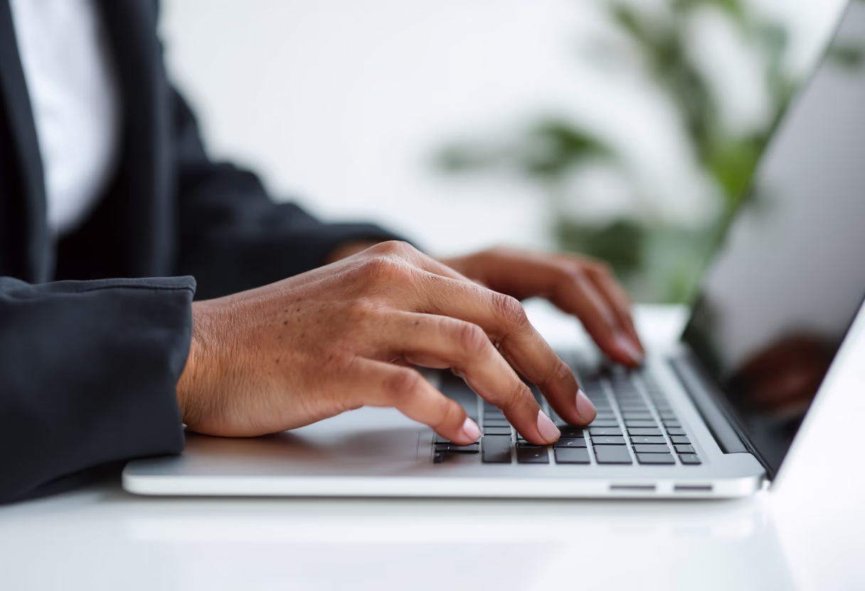 image of an individual typing on a laptop (for a productivity tools business)