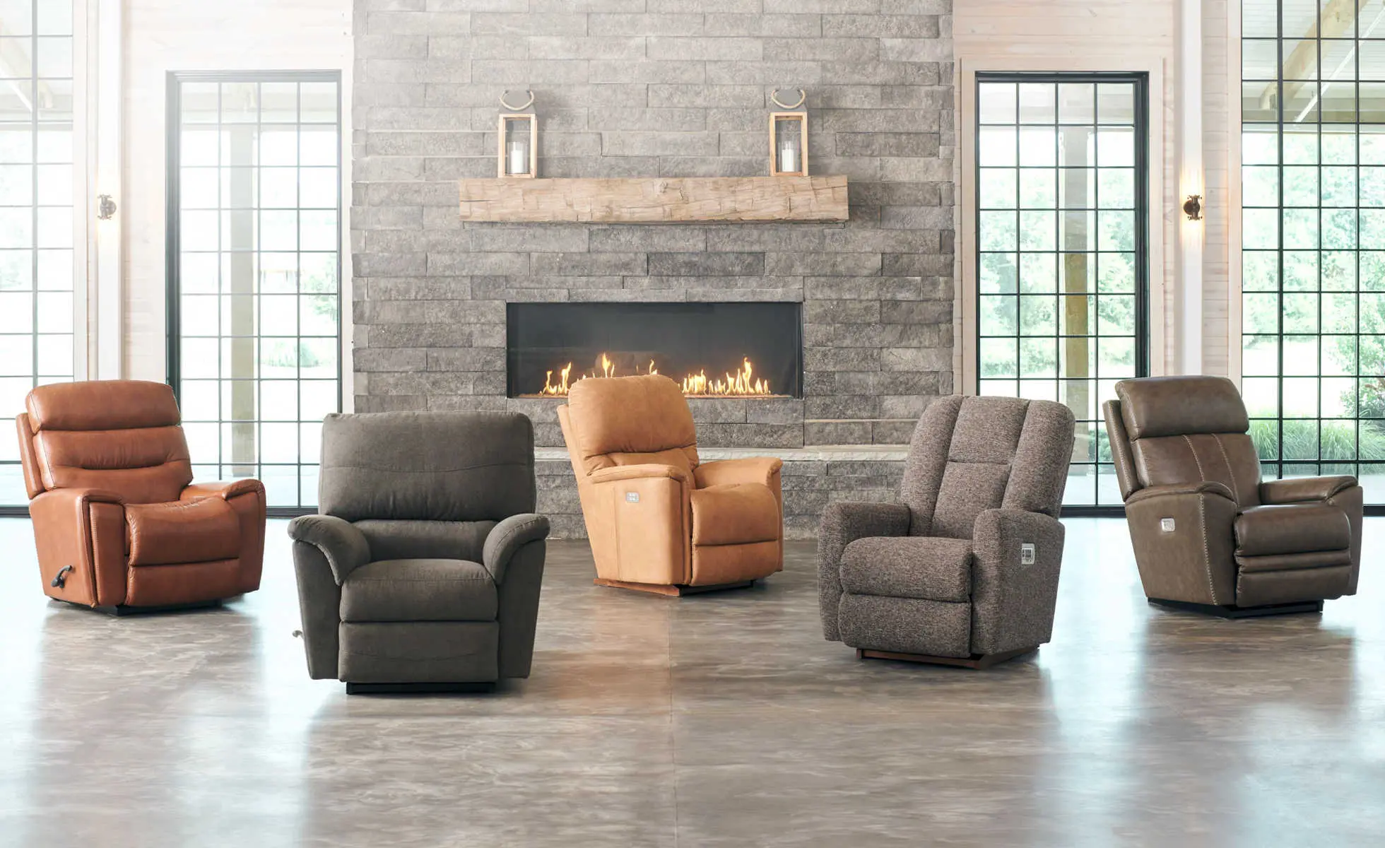 Different recliners in front of a fireplace