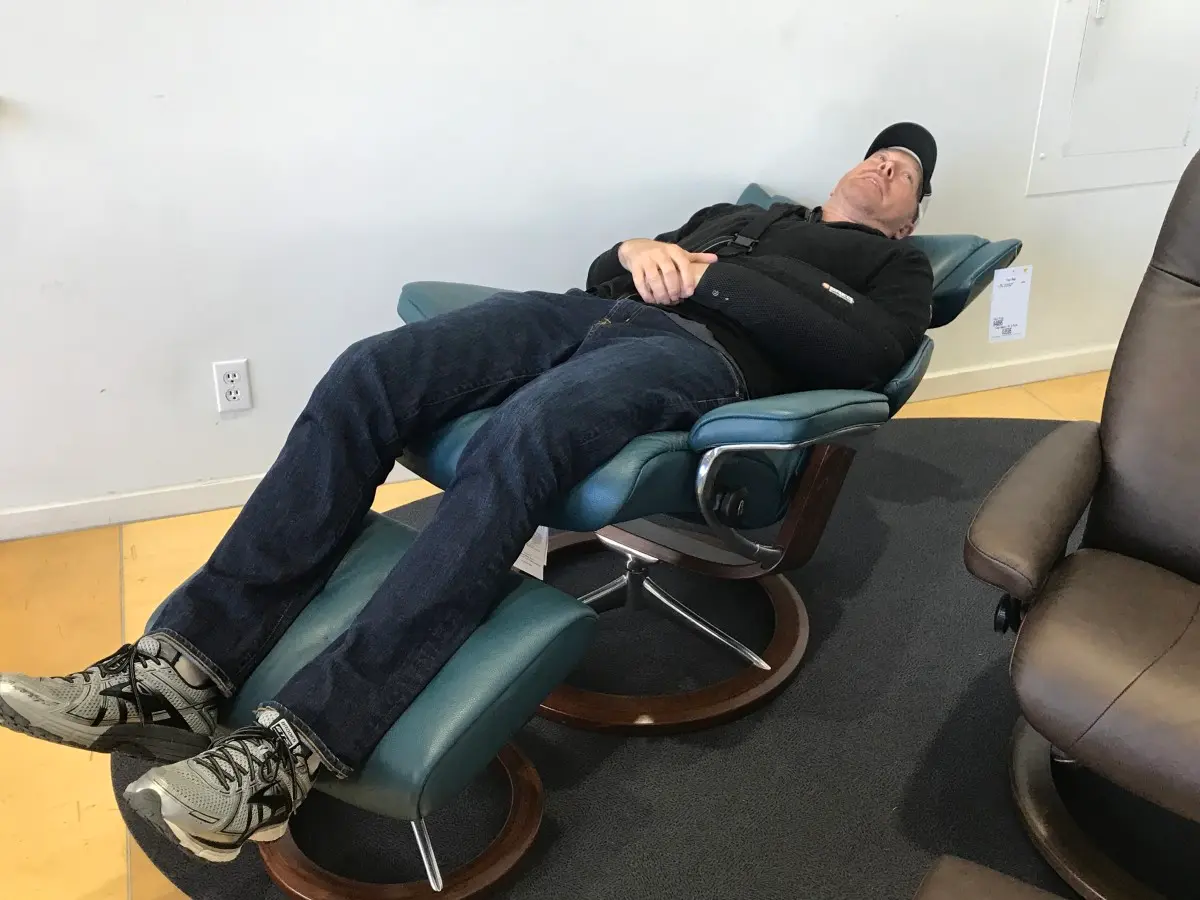 Man laying on a reclining chair
