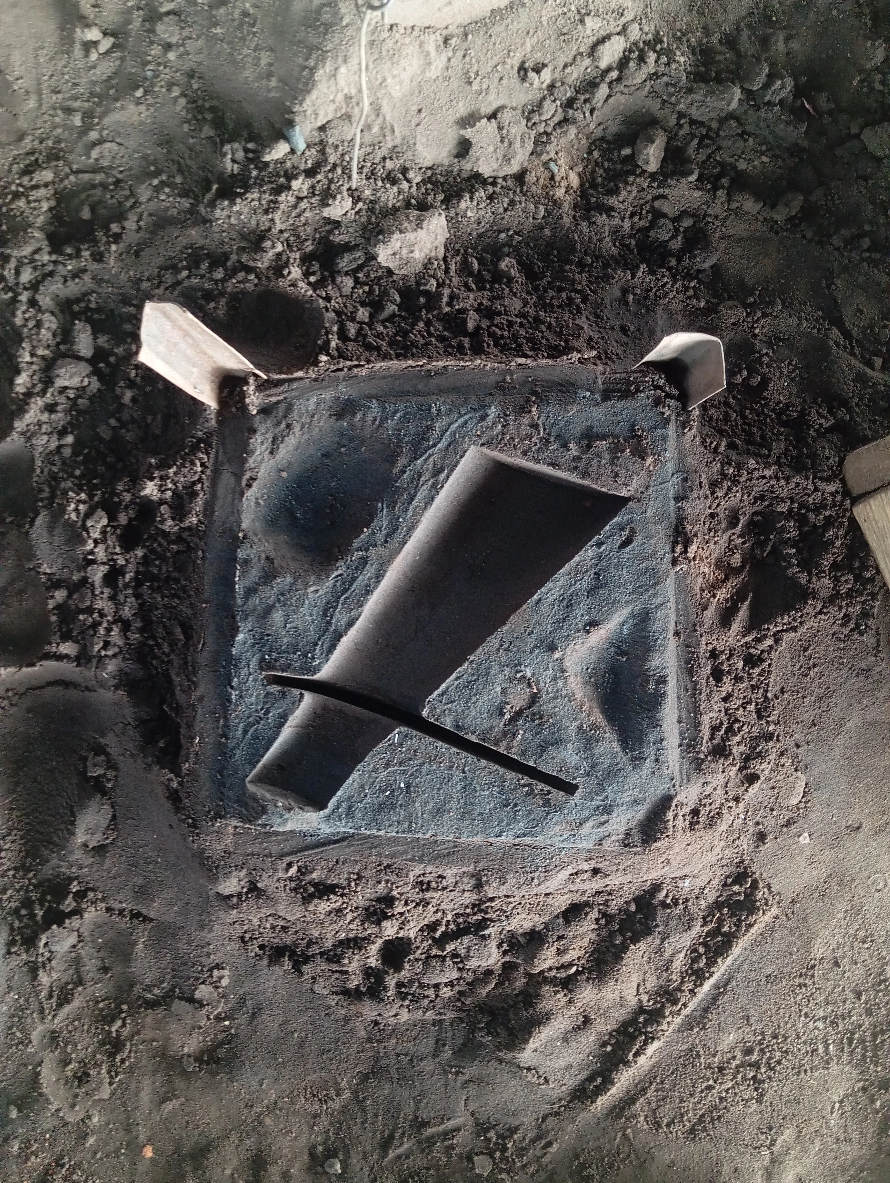 Sand mould cross-section showing Adala vase form before casting