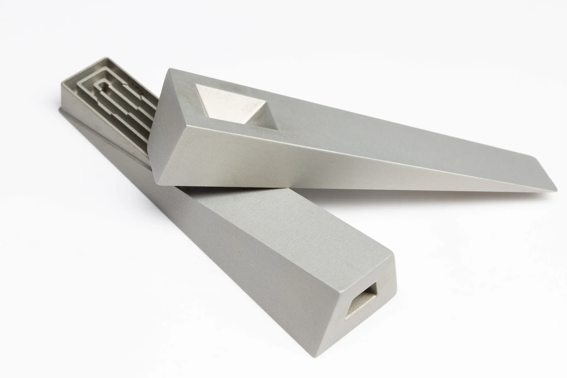 a modern smoking pipe called Tempest with the lid removed laying across the body, shown in silver mercury finish