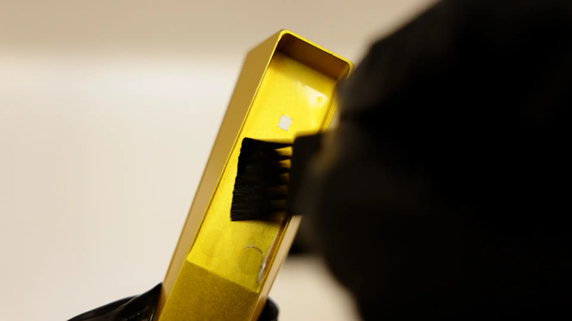 Brush cleaning the inside channels of a metal pipe