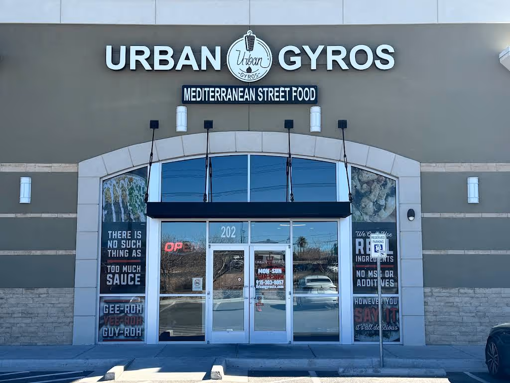 Front entrance of Urban Gyros Mediterranean street food restaurant with signage and glass doors.