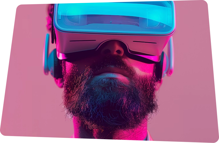 Bearded man wearing a virtual reality headset lit with pink and blue lighting against a pink background.
