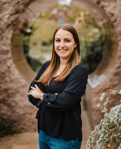 Photo of Karyn O'Neill, woman with brown and blond hair and brown eyes wearing black shirt