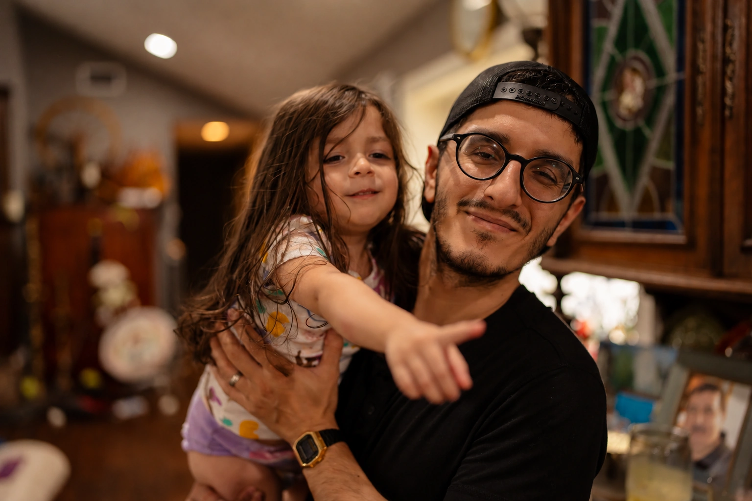 Wael Esmair holding his daughter 