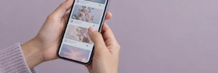 Hands scrolling a social feed