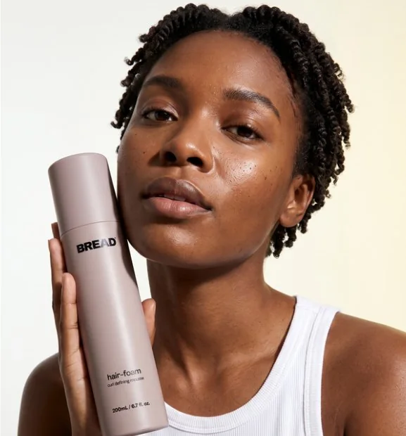 Short natural TWA, holding hair-foam