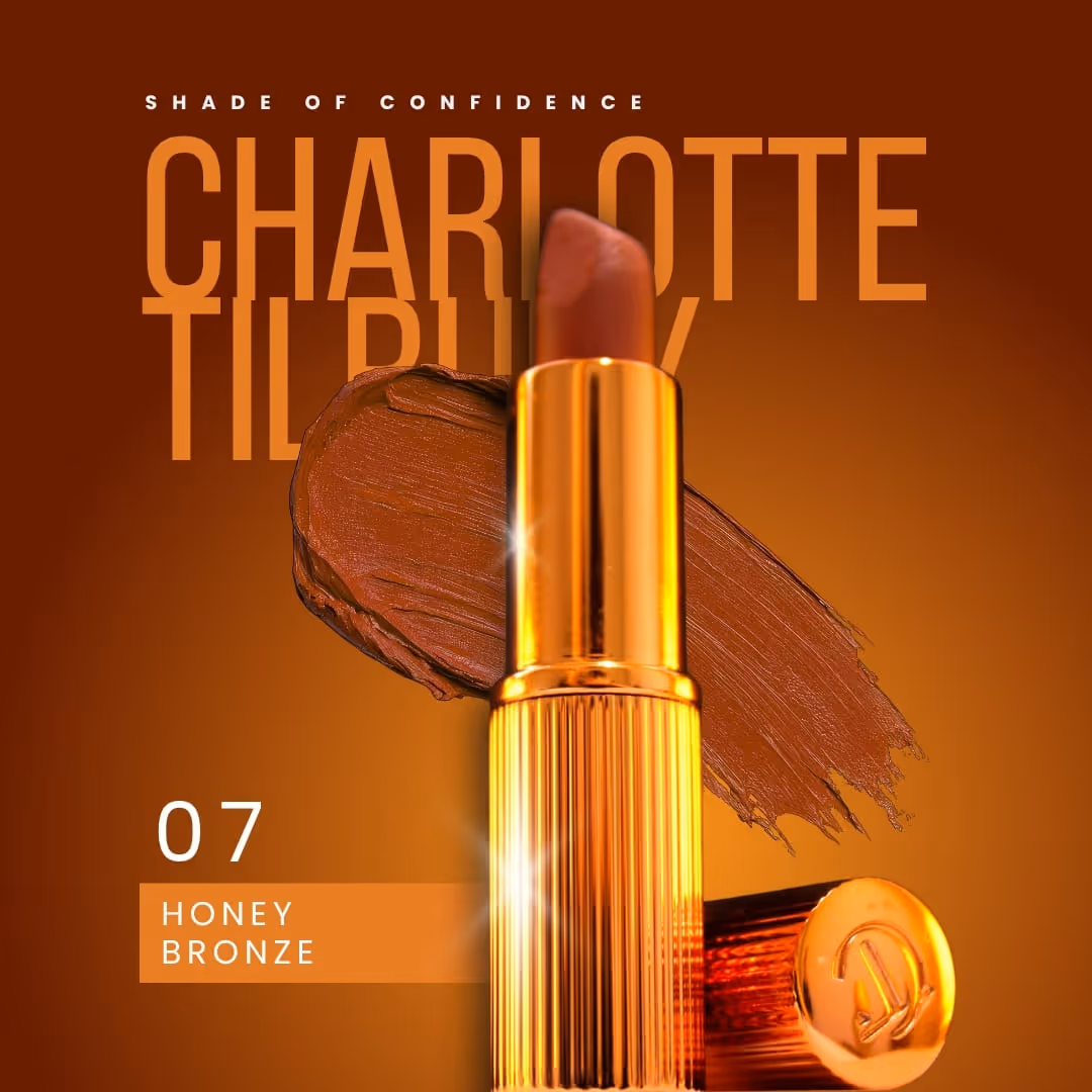 Charlotte Tilbury lipstick shade 07 Honey Bronze with a gold tube and brown lipstick smear background.