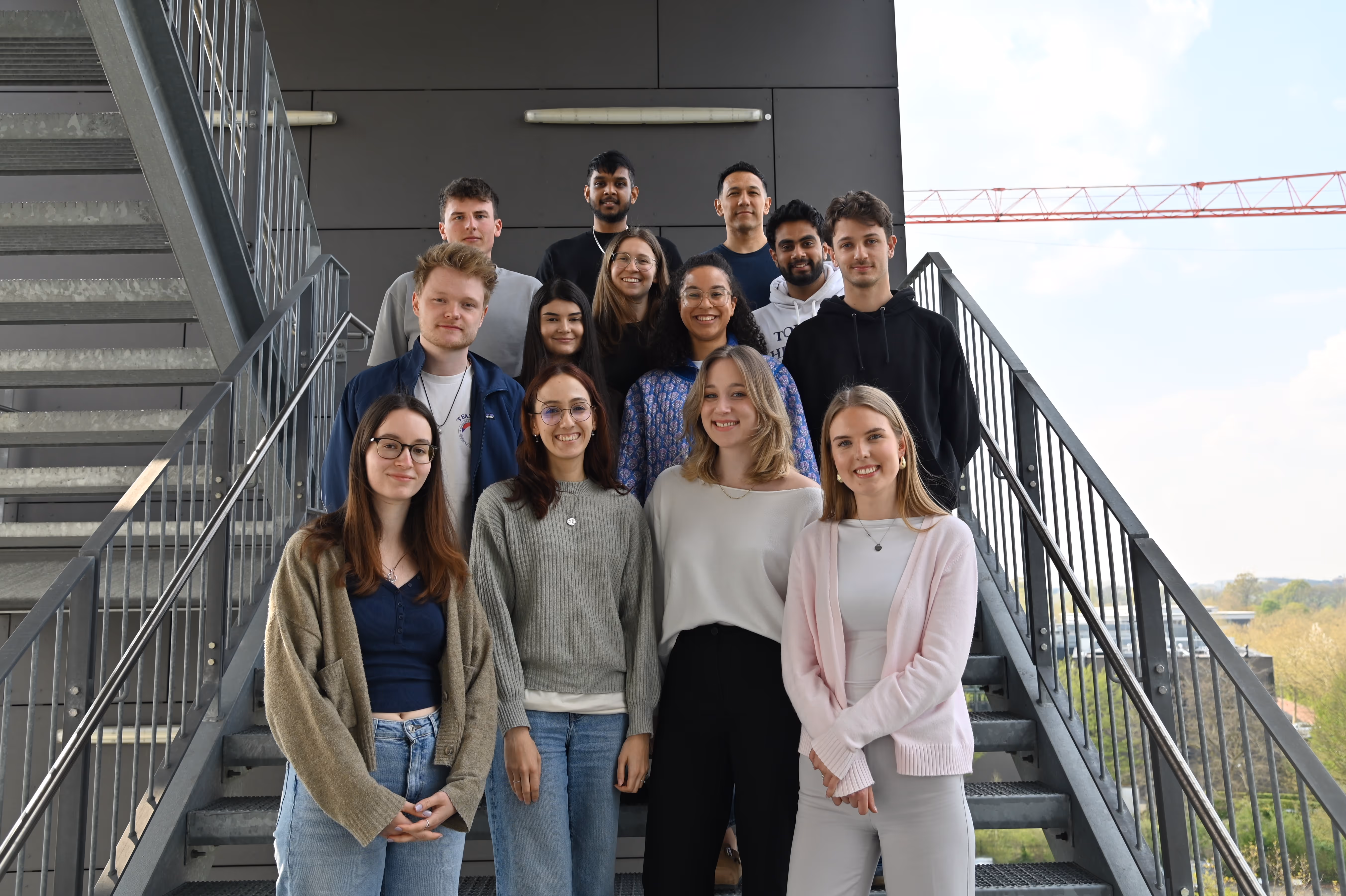 IMS students at FH Münster standing on the staircase, representing prospective applicants and the international student community of the Master's program.
