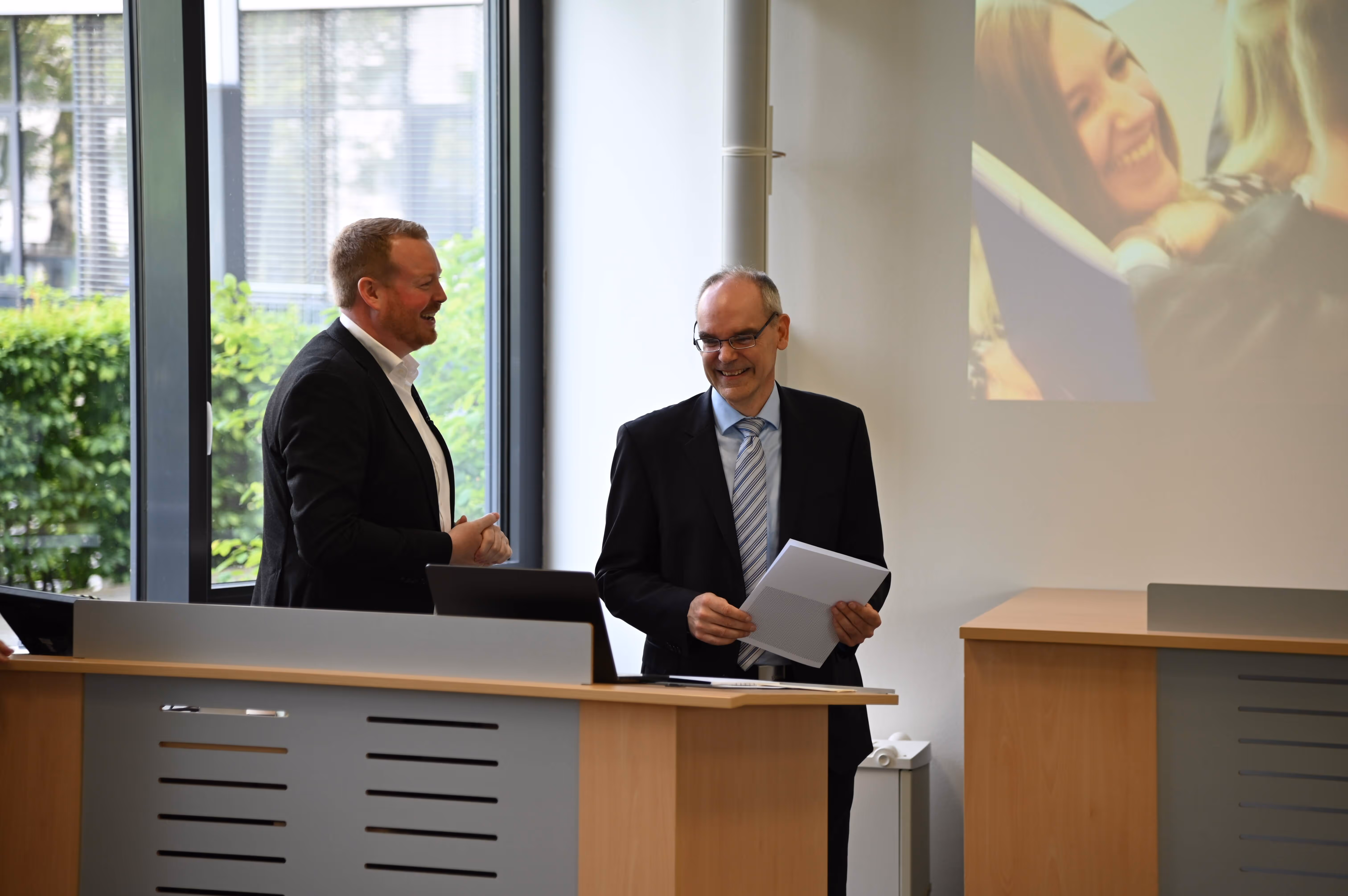 Faculty members (Nils Ommen, Bert Kiel) speaking during the IMS Graduation Ceremony at FH Münster.