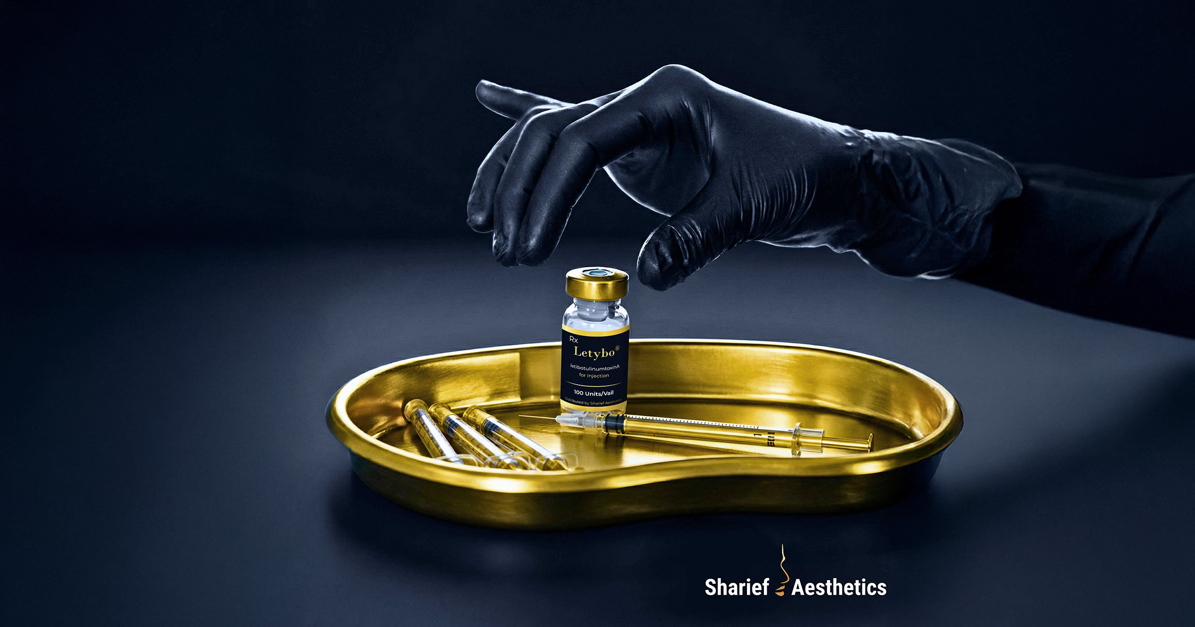 Clinical preparation of a Letybo neuromodulator vial and precision needles on a gold tray by a medical practitioner at Sharief Aesthetics in Halifax.⁠