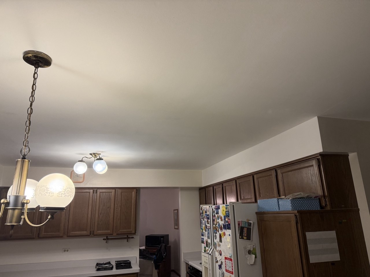 Kitchen ceiling opened for water damage drywall repair in Naperville, IL