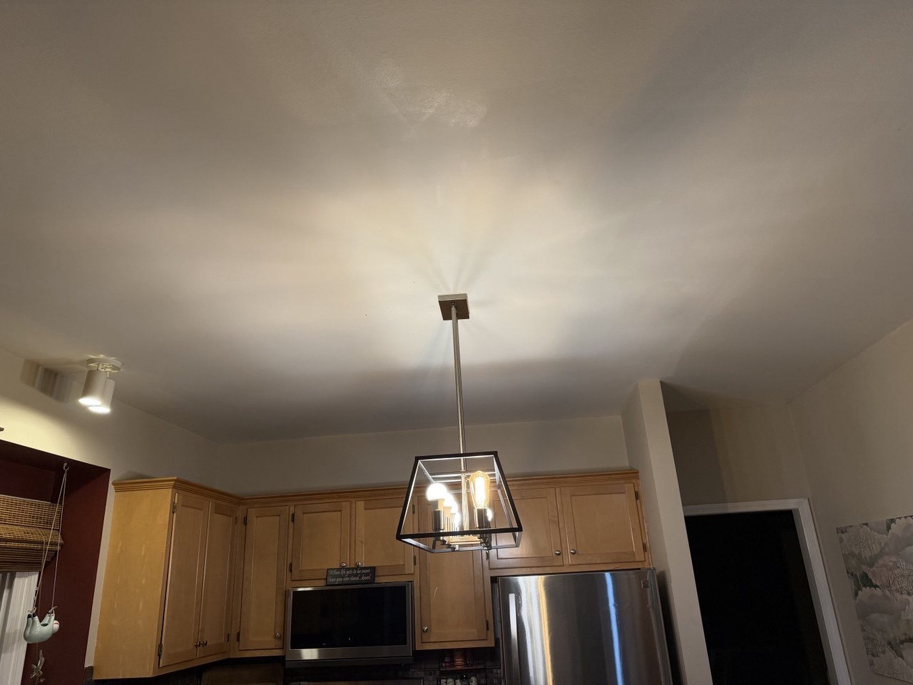 Kitchen ceiling after drywall repair and smooth finish in Aurora IL
