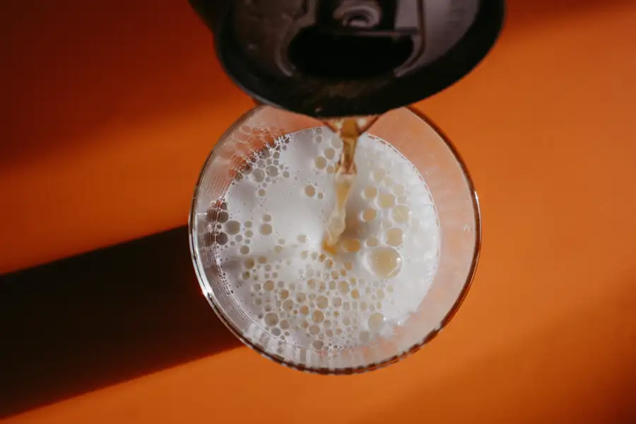 Bubba Hazy IPA being poured from above