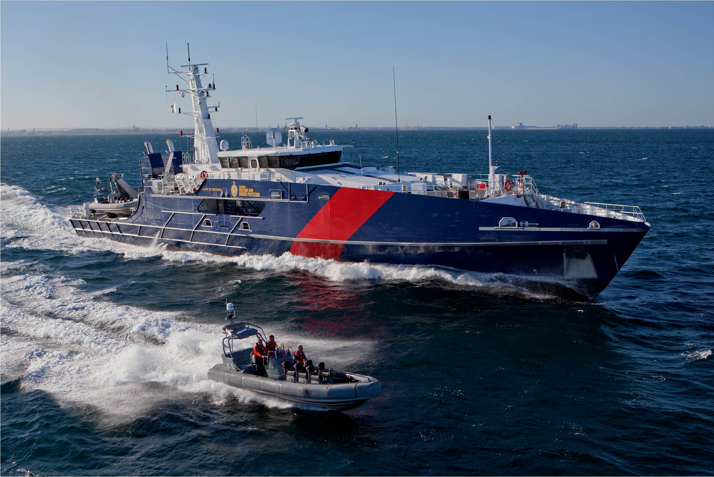 A Royal Australian Navy patrol vessel at sea fitted with Reflective Blinds Australia solar blinds