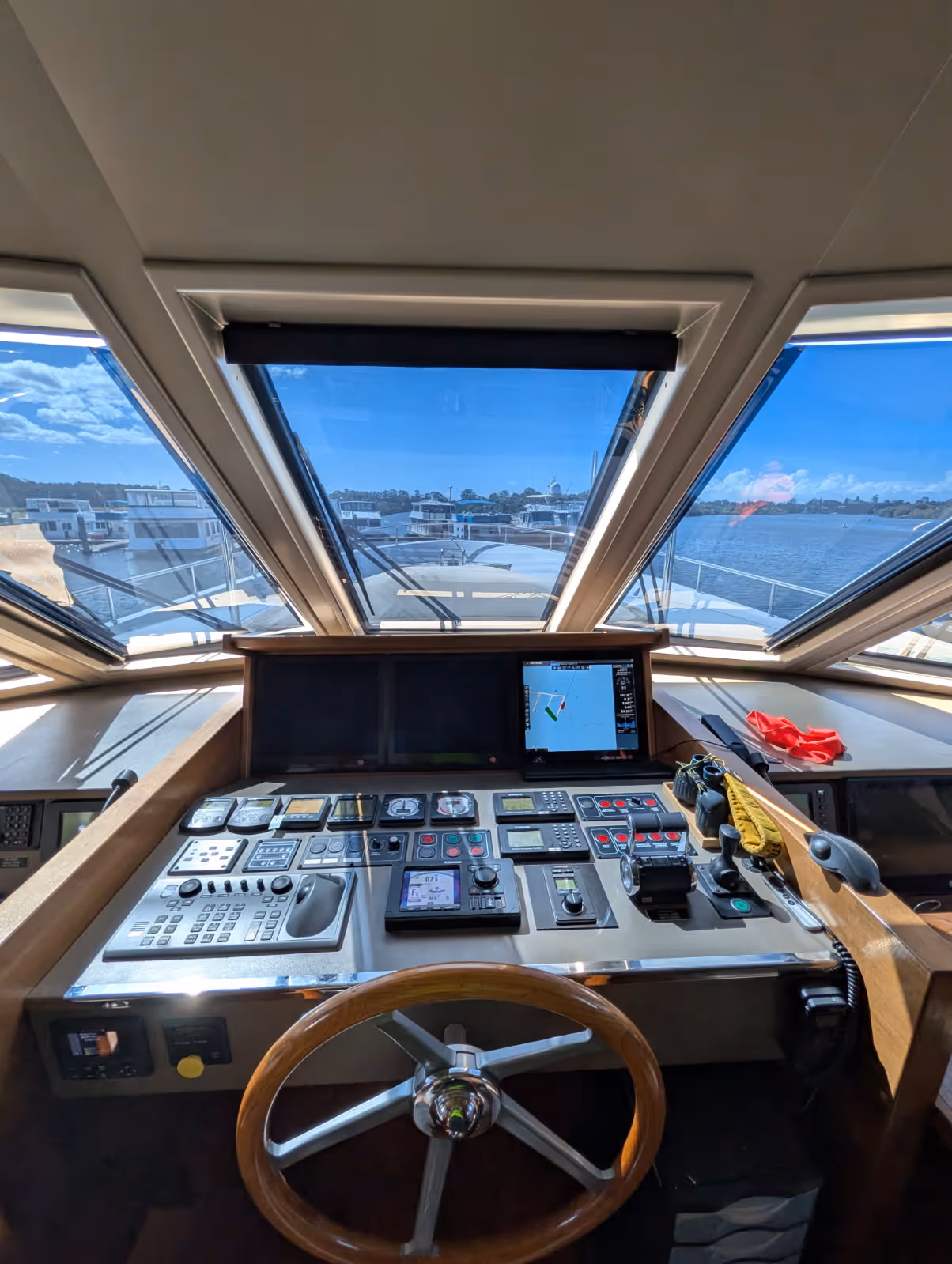 Boat cockpit interior with an angled trapezoid window outlined in white