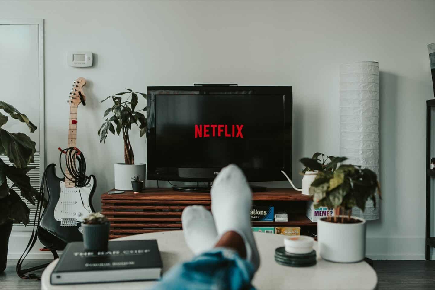 Person watching their TV with Netflix on the screen