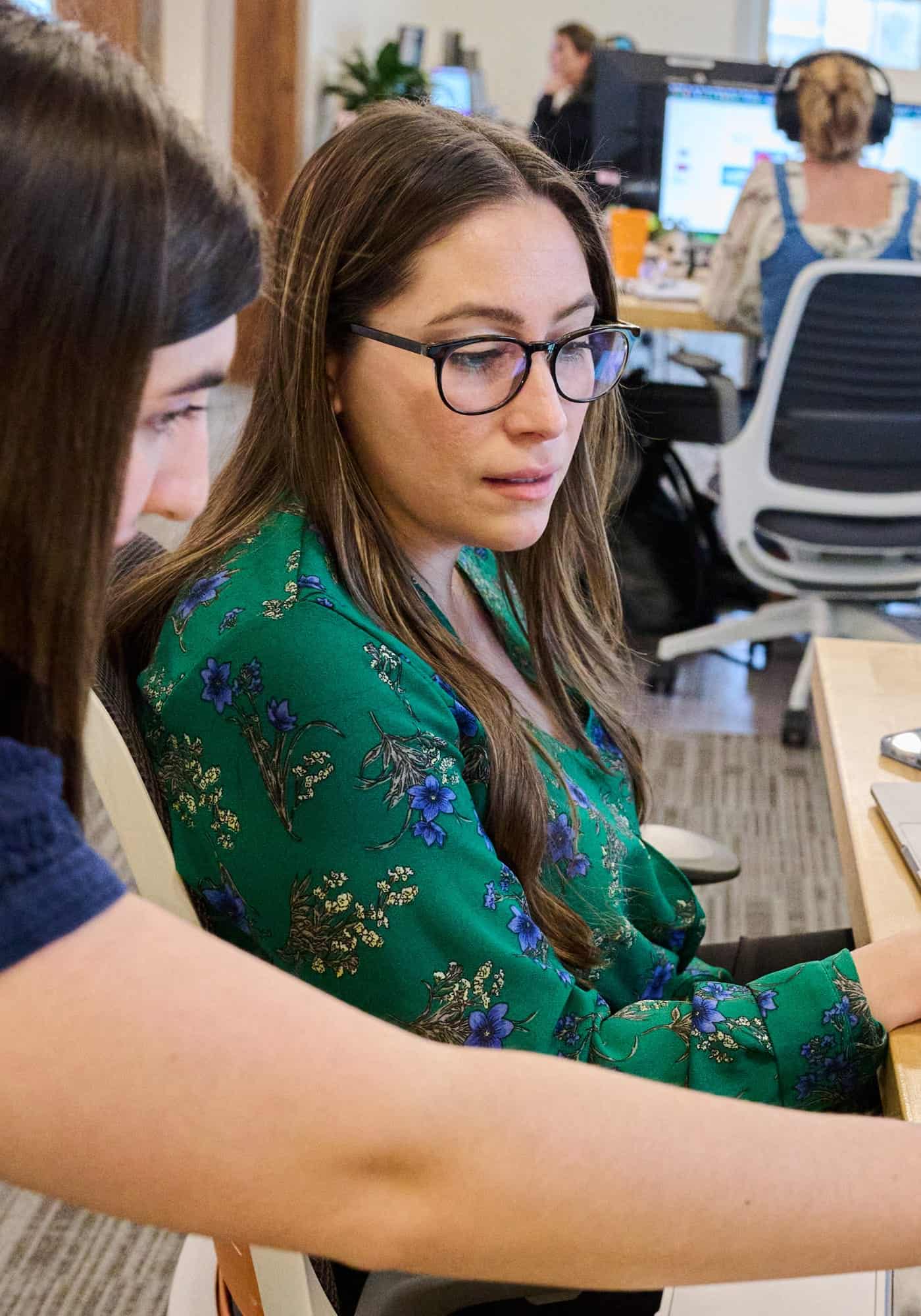 two women collaborating on work