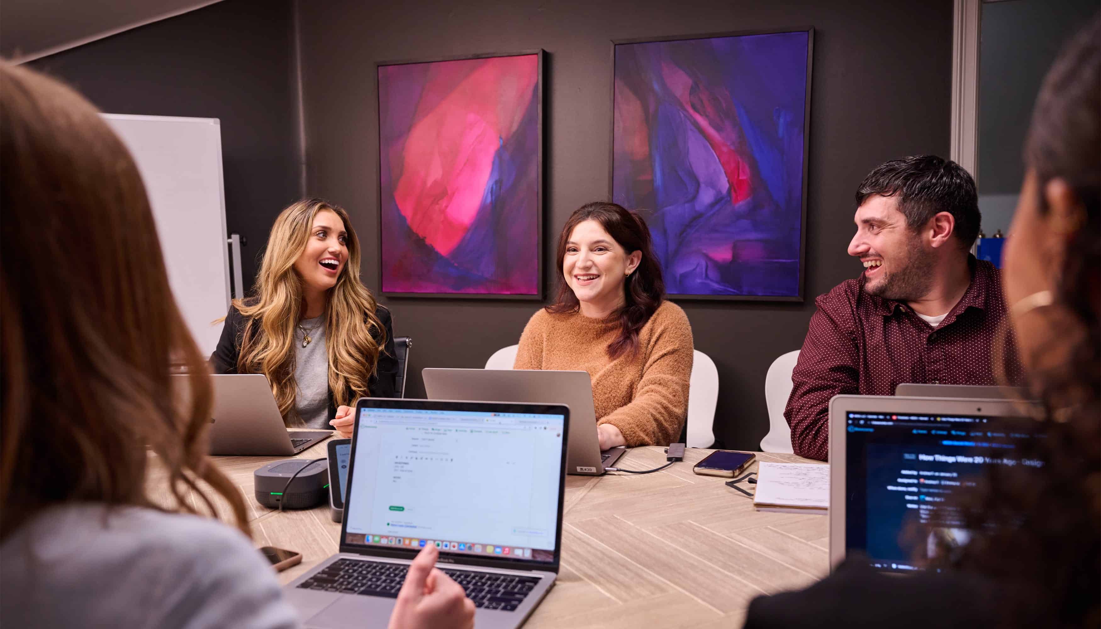 people sitting around a conference table working