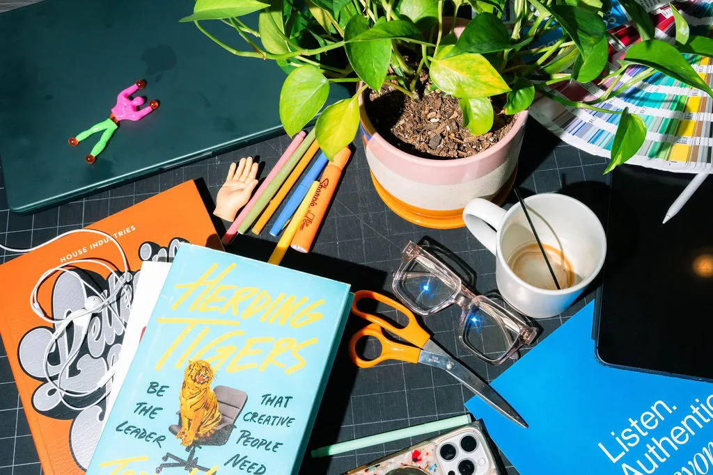 Various art, books, and toys on a table
