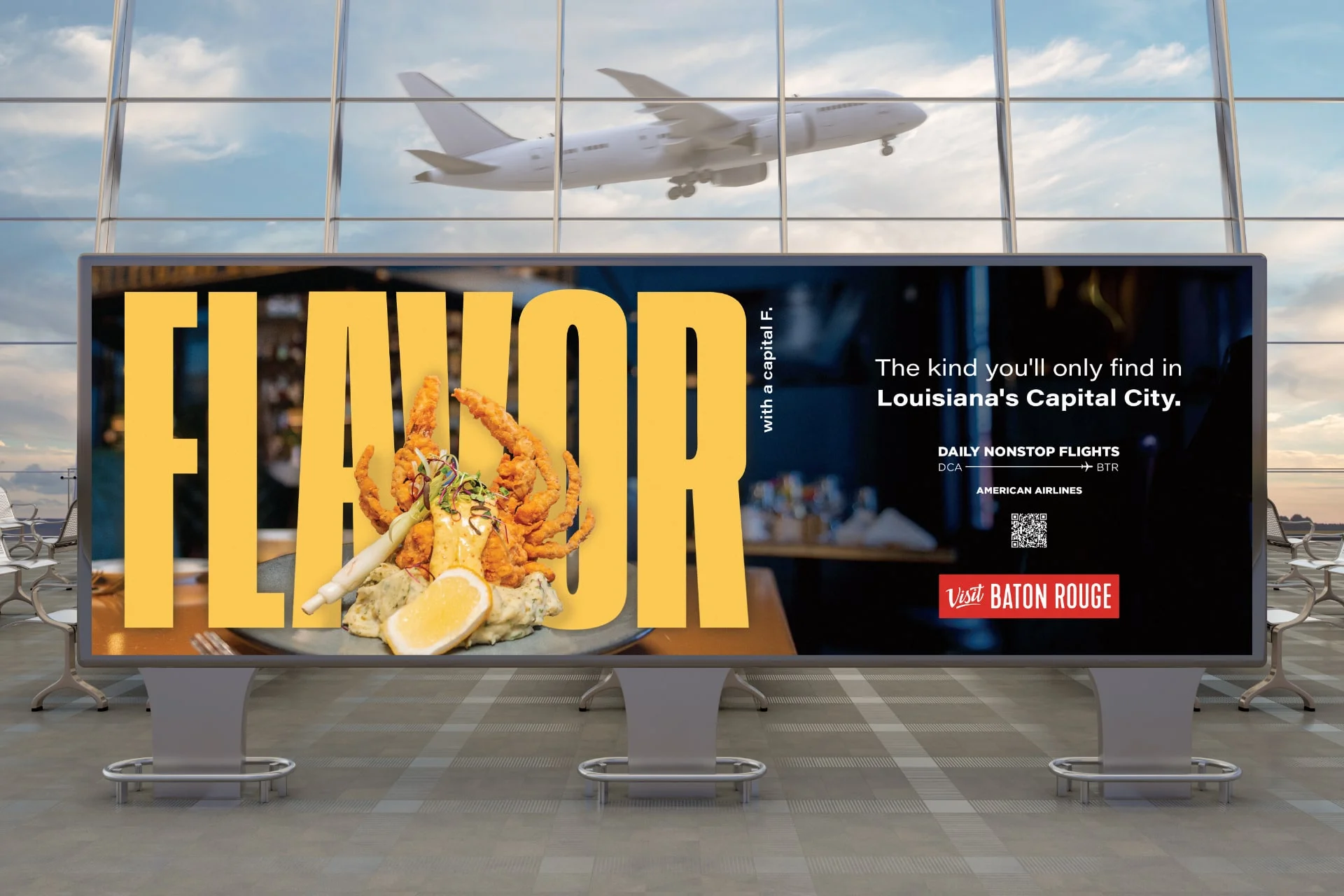 Airport billboard with Visit Baton Rouge banner that says in large letters FLAVOR with a Capital F