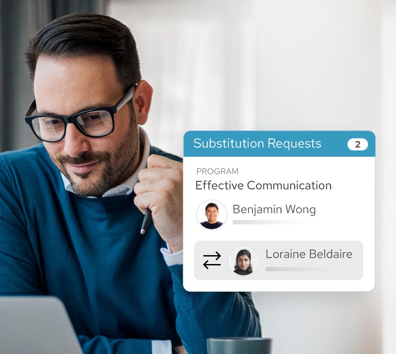 Man wearing glasses and blue sweater using a laptop, with a digital overlay showing substitution requests for the Effective Communication program involving Benjamin Wong and Loraine Beldaire.