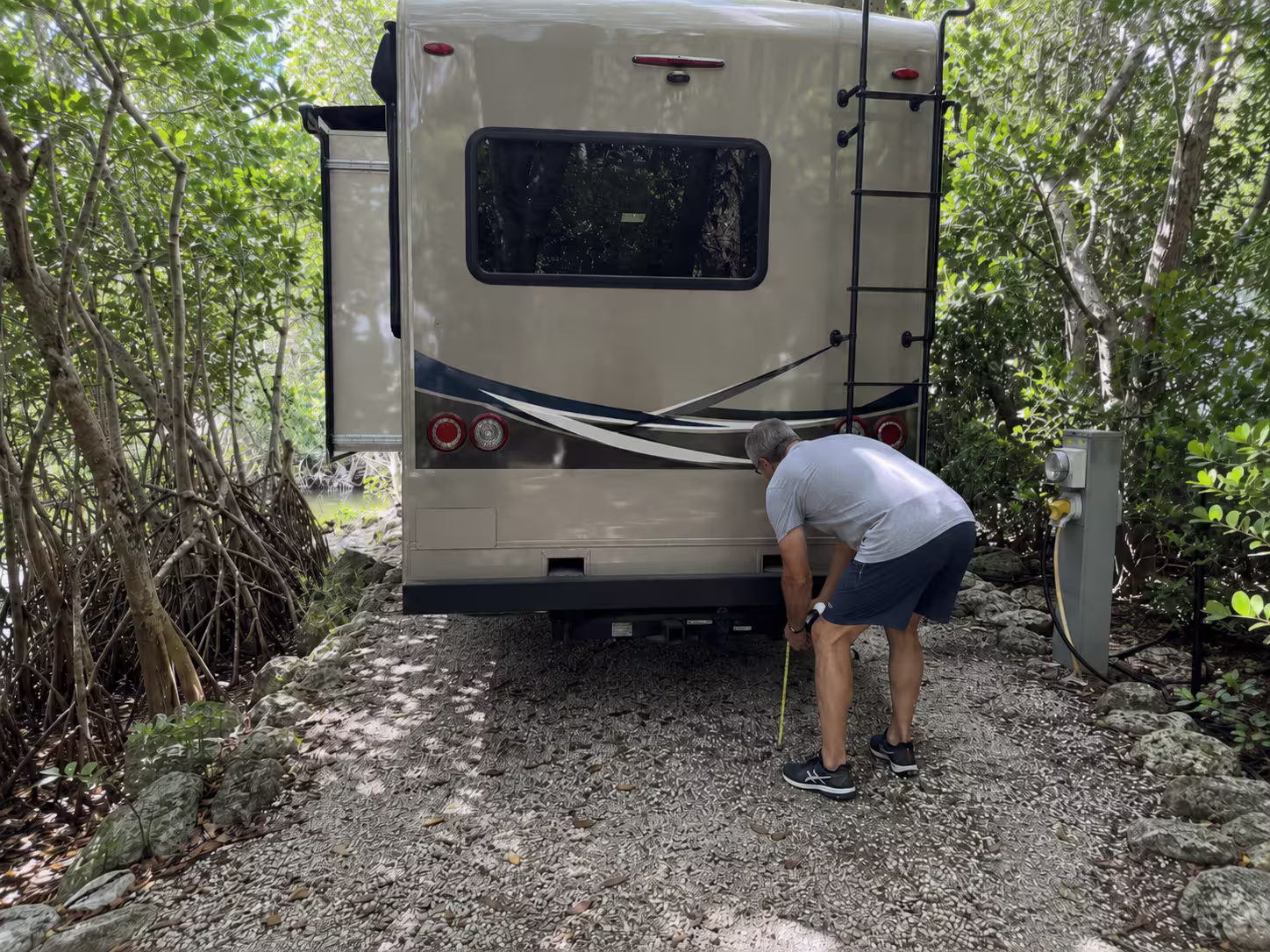 Camper rental backed into a narrow South Florida campsite