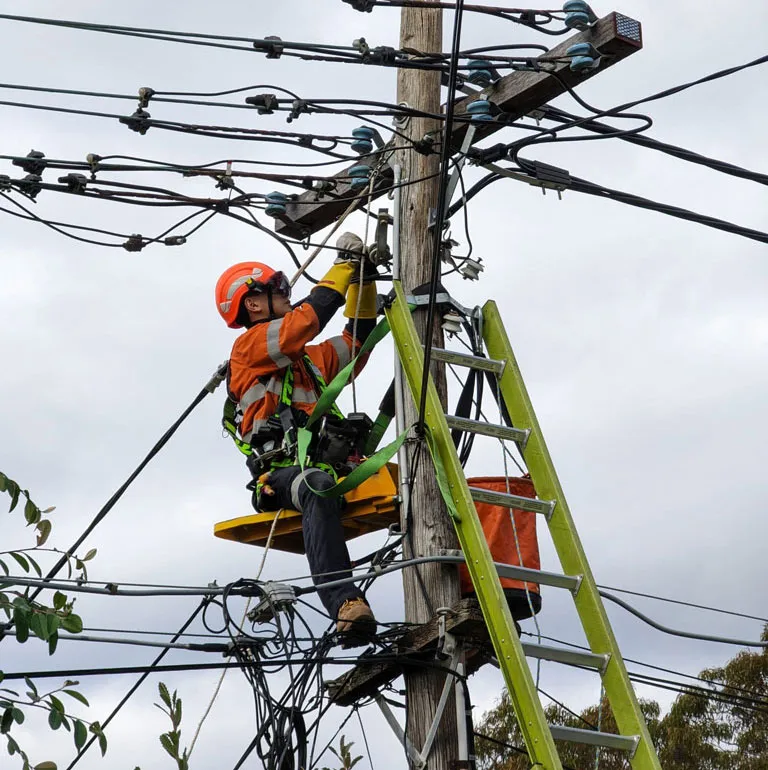 Electrician on electric post