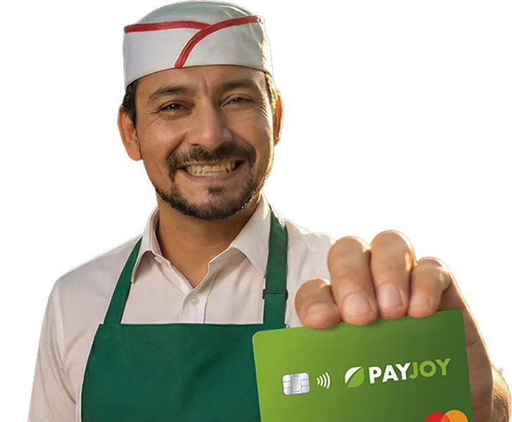 Smiling man in white shirt and green apron holding a green PayJoy card with Mastercard logo.