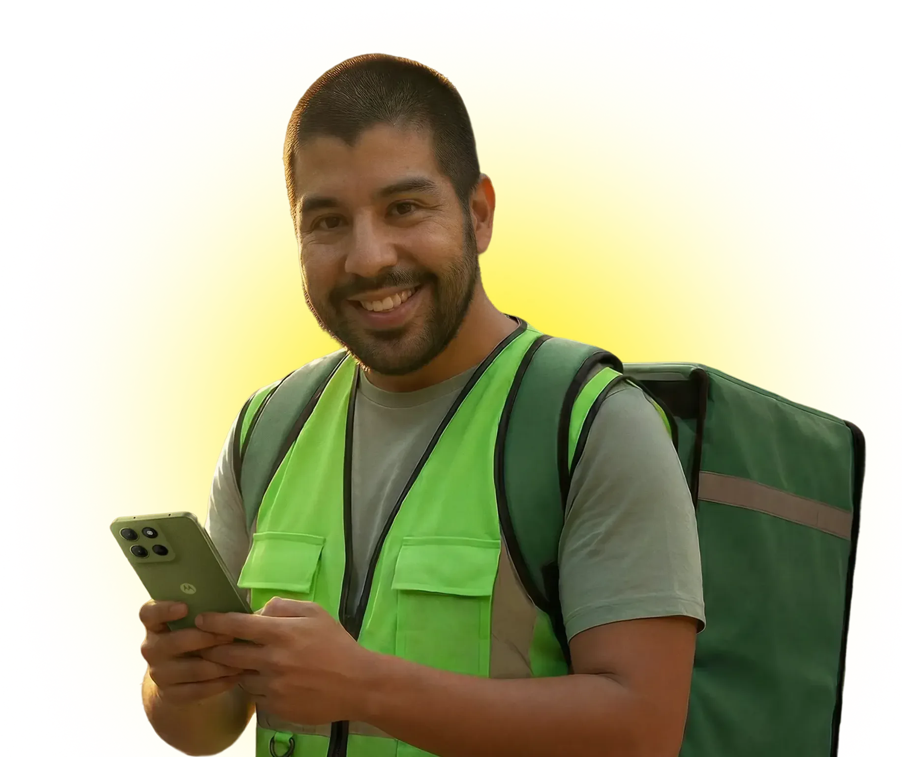 Smiling delivery man in green vest holding a smartphone with a large green backpack against yellow background.