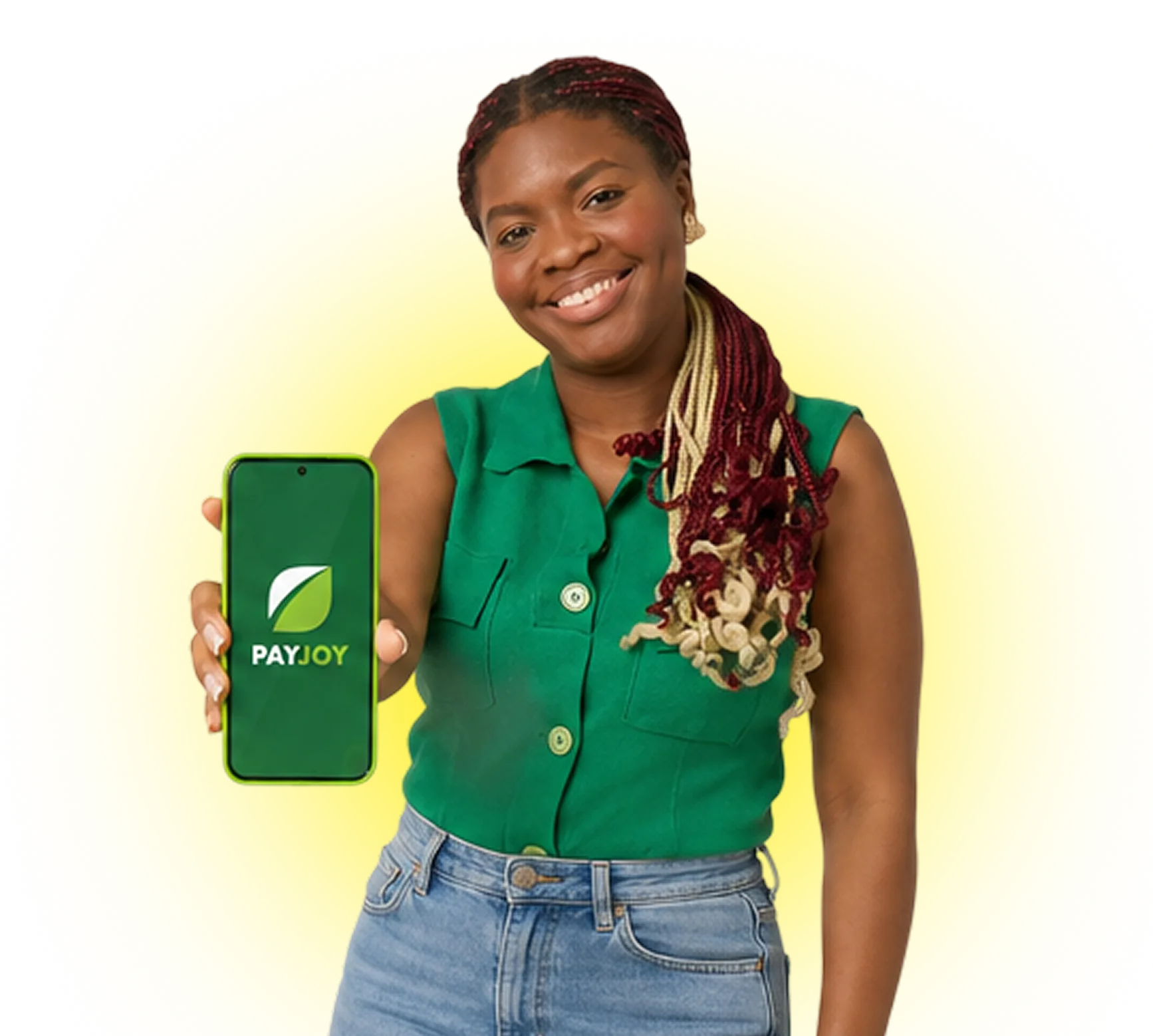 Smiling woman with braided hair holds phone displaying PayJoy app logo on green screen.