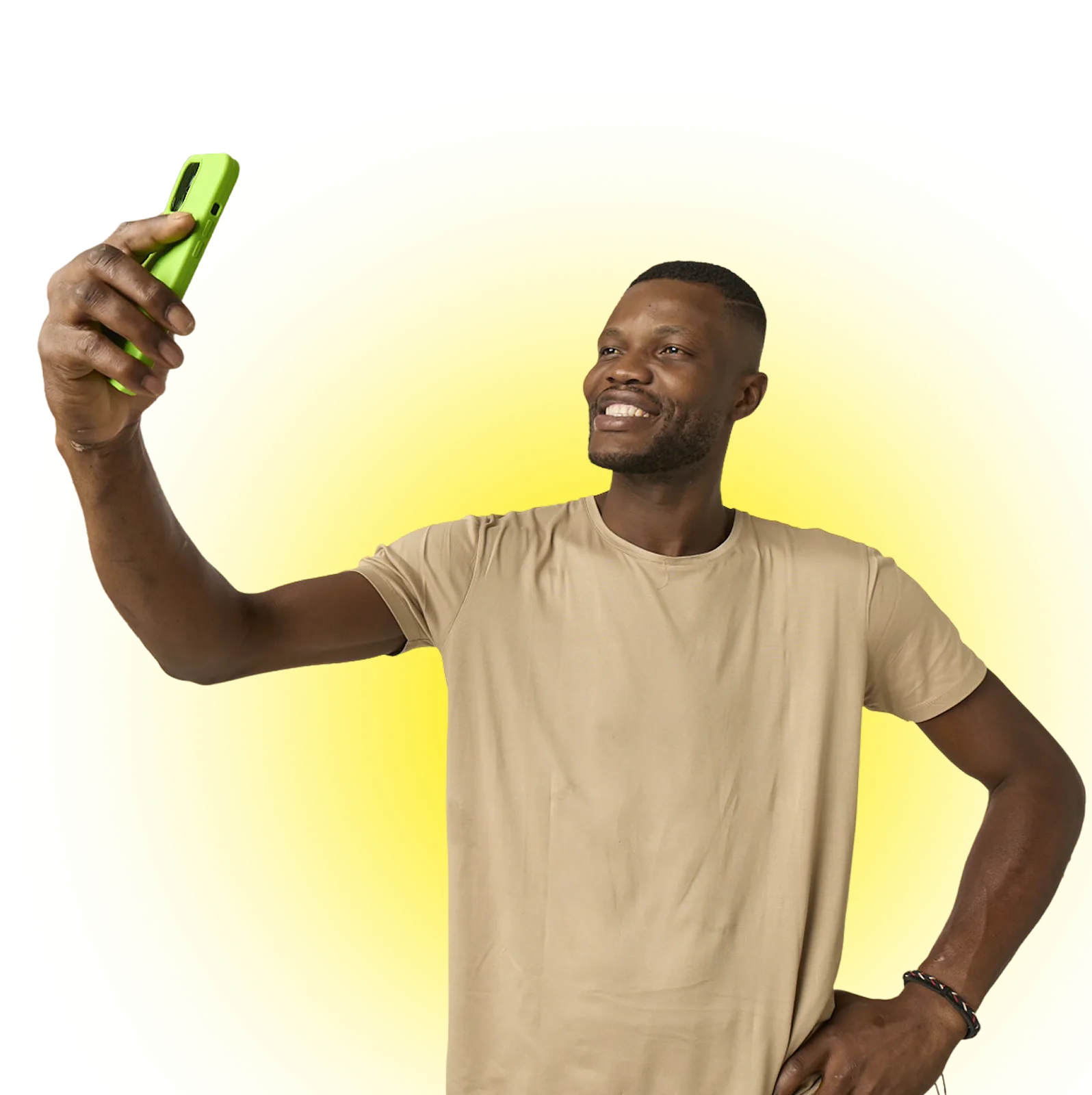 Smiling man in beige t-shirt taking a selfie with a green phone against a yellow background.