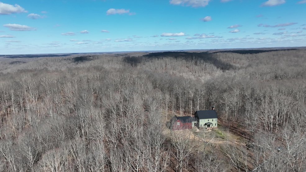 Dark bronze standing seam metal roof on a farmhouse in Columbia, TN