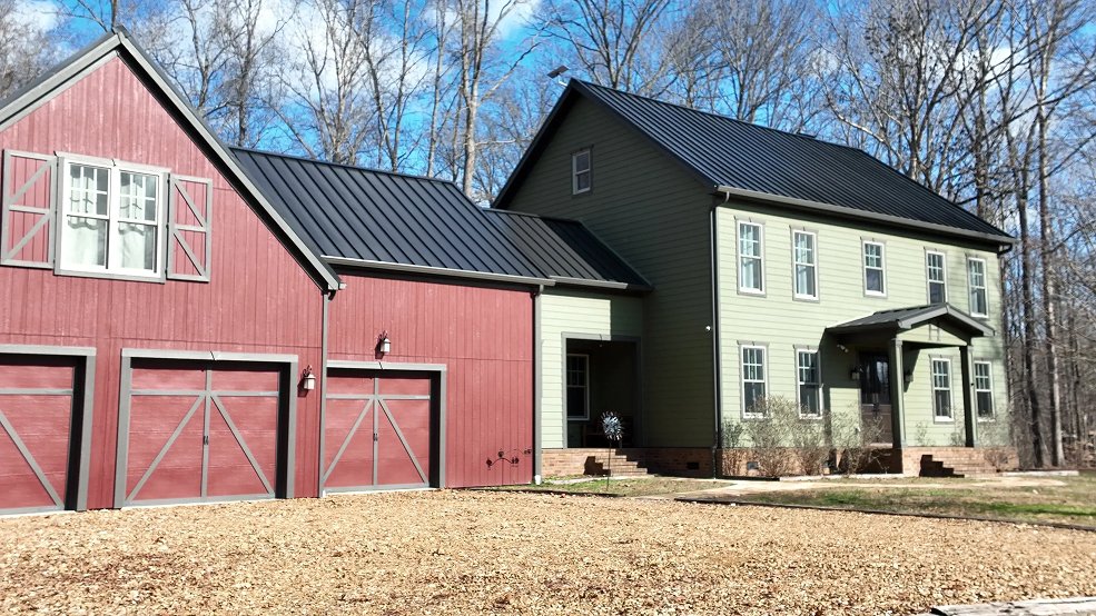 Dark bronze standing seam roof and gable end on a farmhouse in Columbia, Tennessee