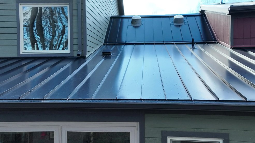 Dark bronze standing seam metal roof installed on a farm house in Columbia, Tennessee
