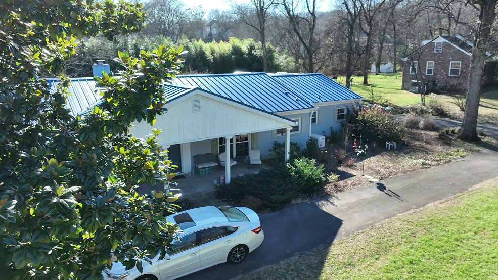 Royal blue standing seam roof detail on a mid century home in Nashville, Tennessee