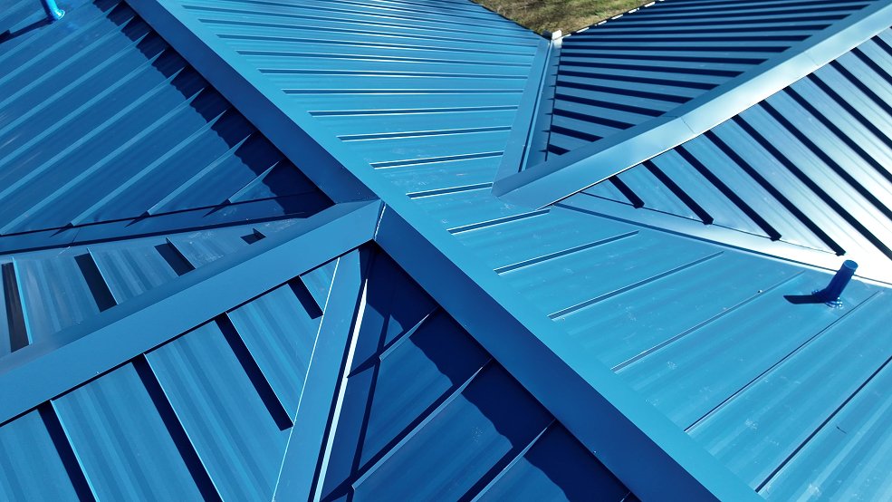 Completed royal blue standing seam metal roof on a mid century home in Nashville, TN