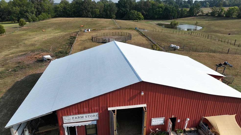 Gray classic panel metal roof on a farm stand building in Lebanon, Tennessee
