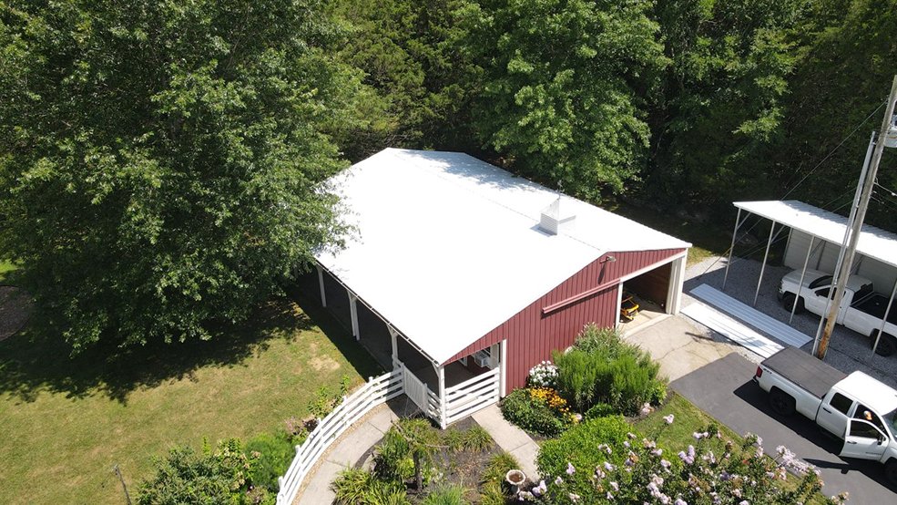 White classic wave panel metal roof on a barn red home in Springfield, Tennessee