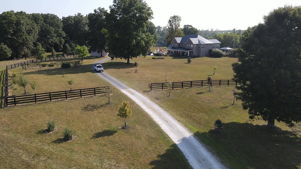 Black classic wave panel metal roof on a farm home in Dickson, Tennessee