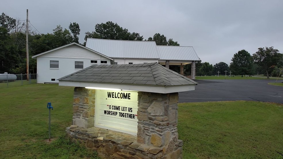 Full view of a silver standing seam metal roof on a church in Shelbyville, Tennessee