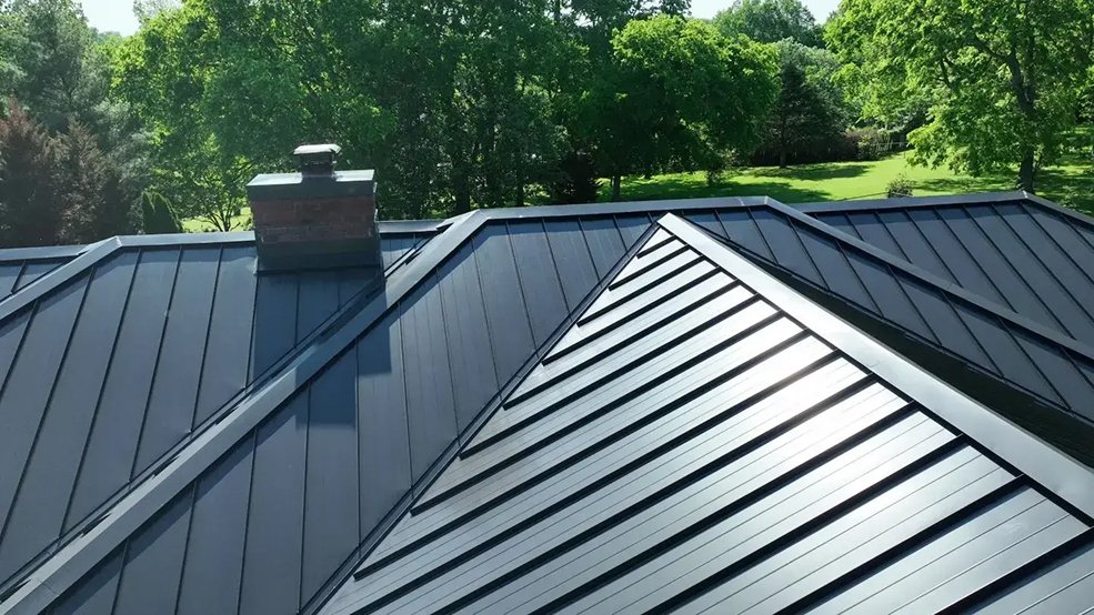 Black standing seam metal roof over a pool house in Brentwood, TN