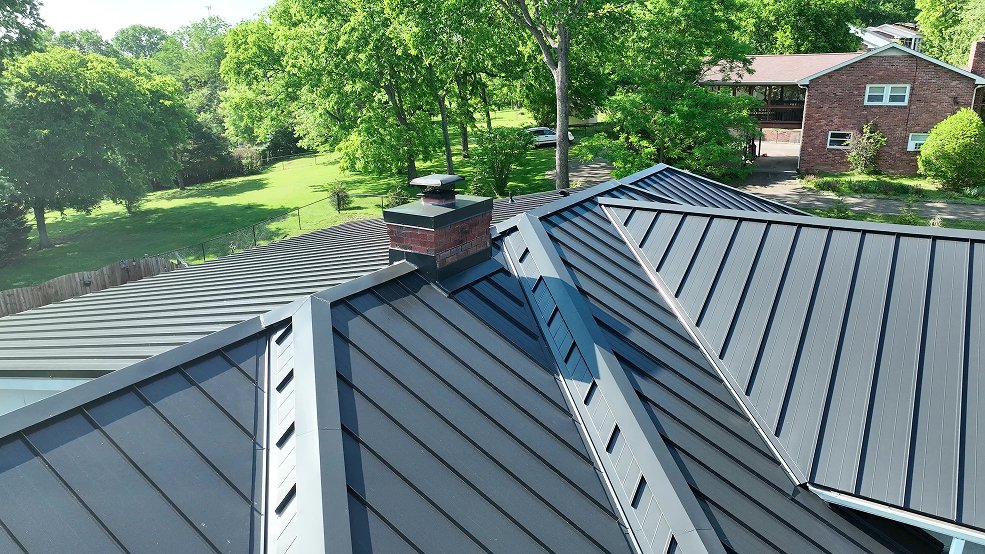 Black standing seam panels on a ranch home roof in Brentwood, Tennessee