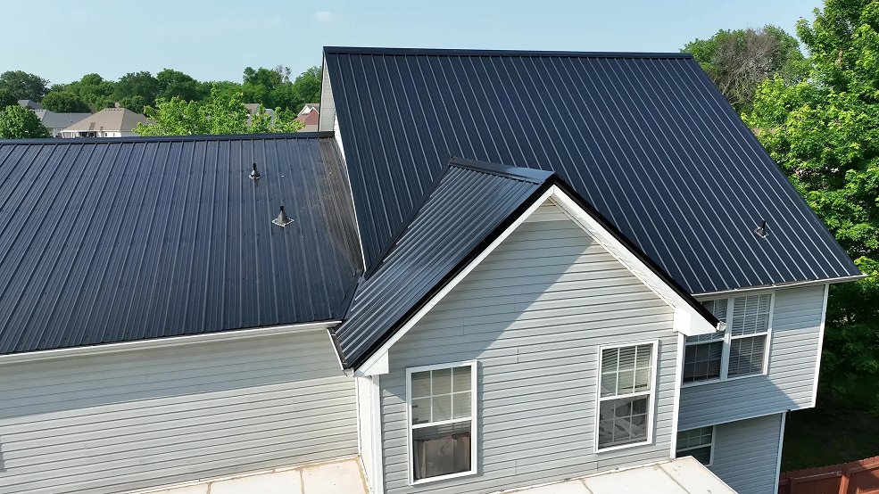 Black classic panel metal roof on a brick home in Hendersonville, Tennessee
